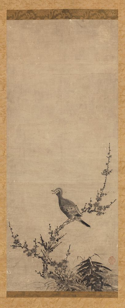 Small crested bird perched with beak open, facing L on a crooked blossoming branch; cluster of bamboo to R of branch on…
