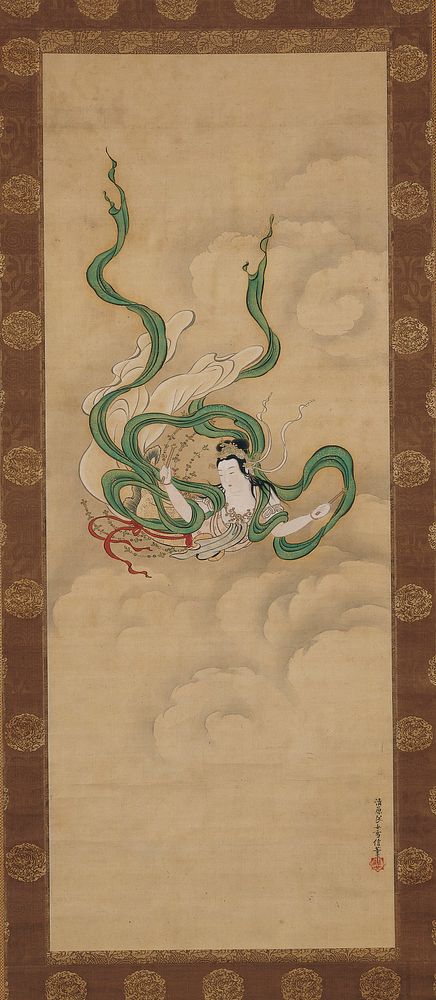 Female figure soaring through clouds with long, trailing green sash; short wooden wand in each hand; strings of beads…