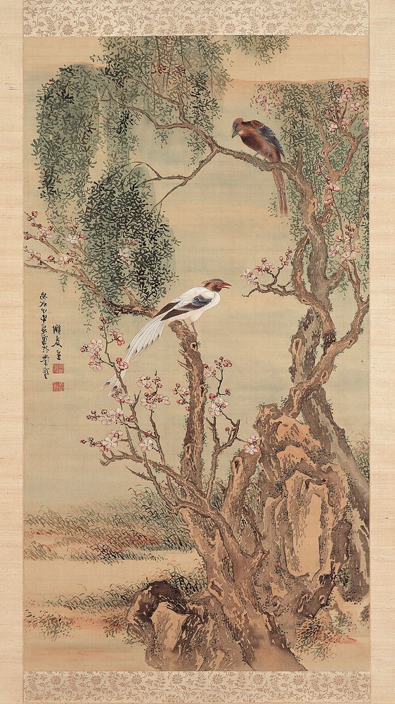 Crested white bird and crested brown bird perched on the branches of a gnarled, twisting tree with pink blossoms; blossoming…