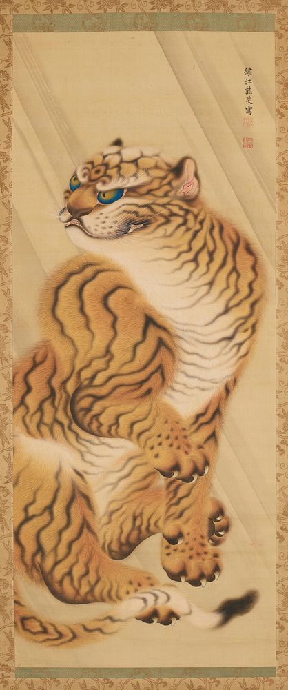 Seated tiger with raised front PR paw, partially open mouth, ears back, and blue eyes. Original from the Minneapolis…