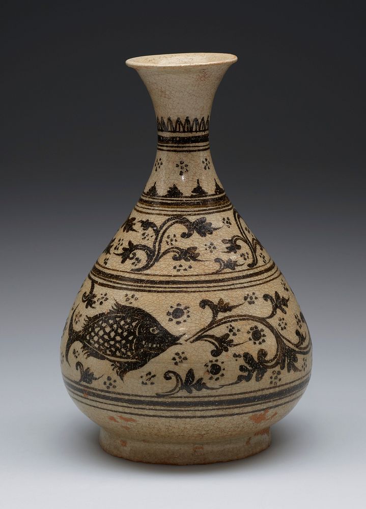 small beige colored vase with bulbous body, narrow neck, flared mouth; dark designs of fish and organic vine motif separated…
