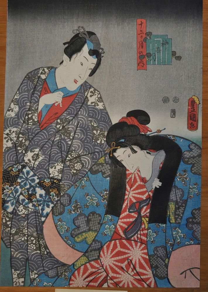 Couple with man at left and woman at right, biting the red and white sleeve of her inner kimono. Original from the…