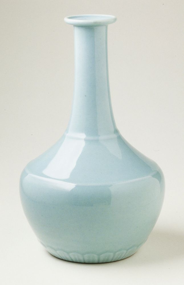 vase, porcelain with clair de lune glaze, flared lip, elongated neck, wide body; raised band of stylized lotus leaves…