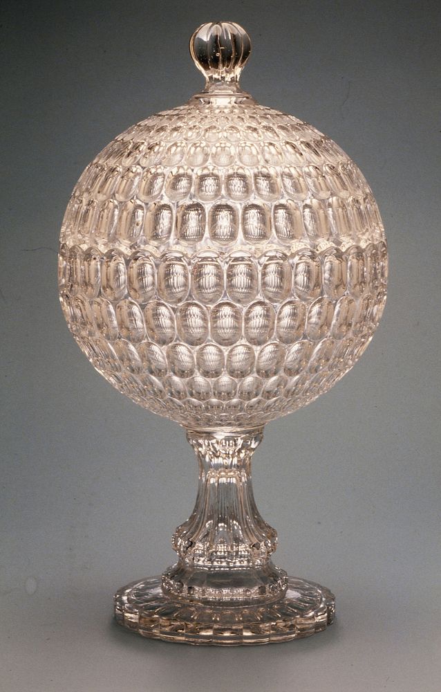 Thumbprint Compote, made by Bakewell, Pears and Company, about 1865, colorless glass, fitted with a dome cover to form a…