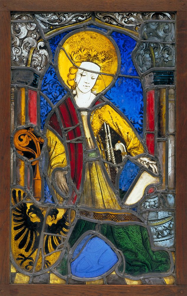standing female saint with two heraldic shields at her feet. Original from the Minneapolis Institute of Art.