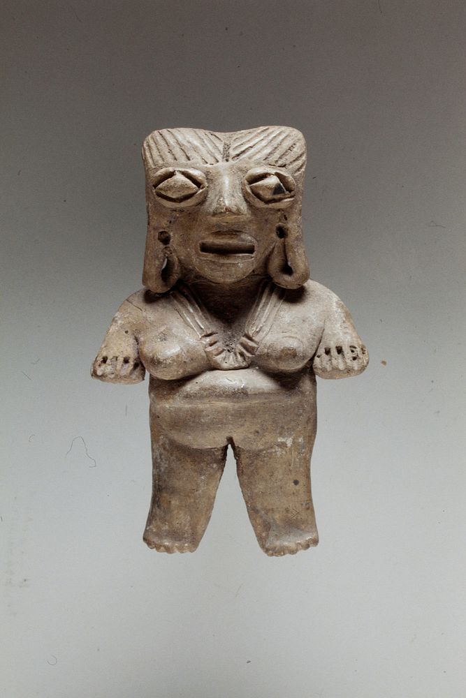 Standing female figure, solid burnished buff clay, arms at sides, incised necklace, hair and diamond eyes, West Mexican…