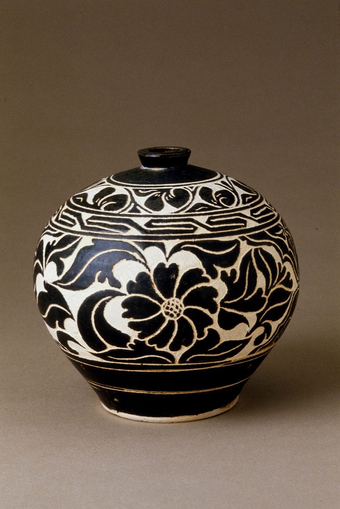 Small Jar, Ts'u-chou ware; stoneware with clear glaze on black and white slip and sgraffito (carved) floral decoration.…