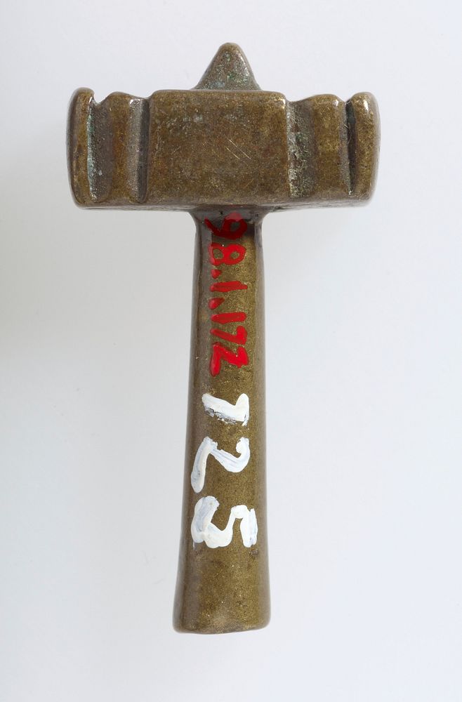 Handle protrudes through top of head; two incised lines on top and sides of mallet head. Original from the Minneapolis…