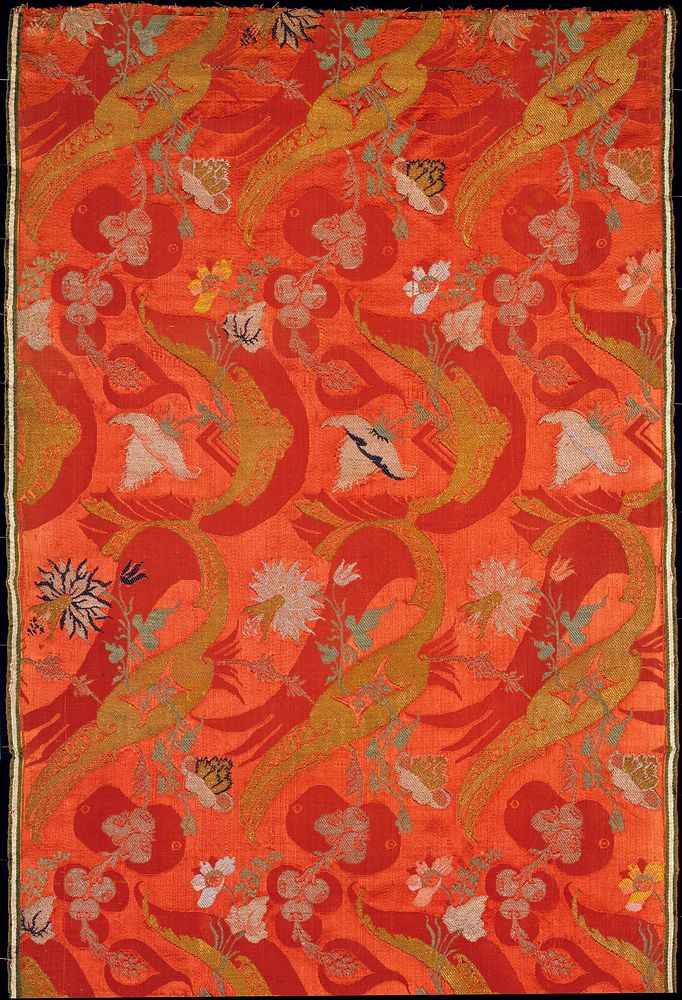 Bizarre brocade work, pink ground with red, gold, silver, and green floral decoration; silk, gold, and silver threads.…