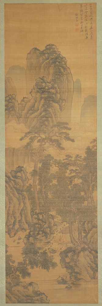 Man with beard and moustache sitting on the banks of a stream with his feet in the water; youth stands behind him; dense…