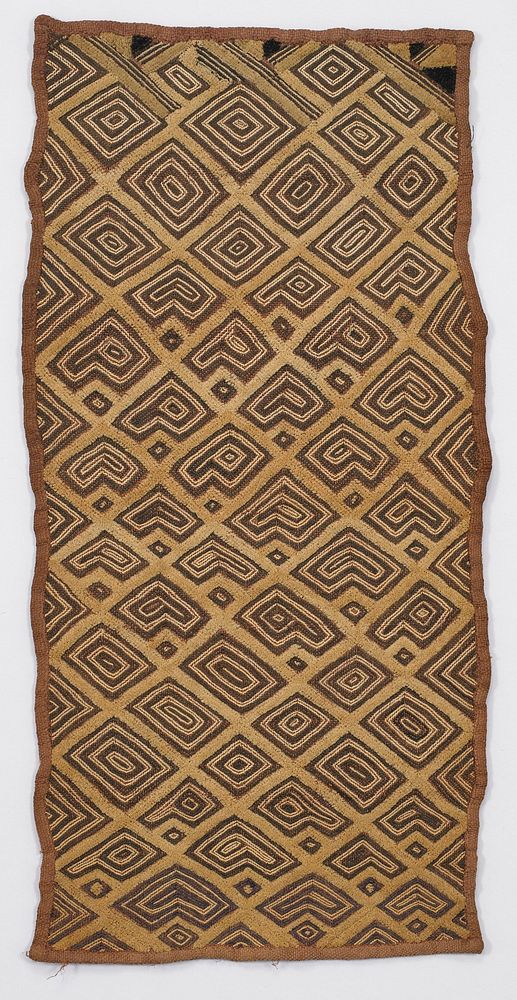 tan and brown, with geometric diamond motif design; 4 dark brown triangles on one short side. Original from the Minneapolis…