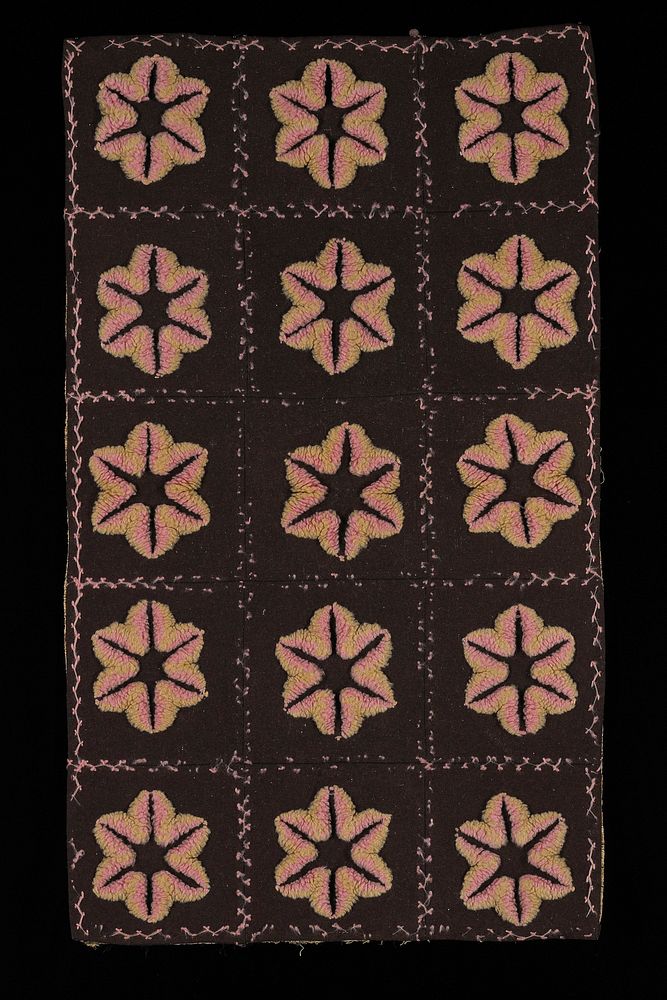 15 brown squares with pink and green tufted floral shapes at center of each; pink stitching between; tan, blue and green…