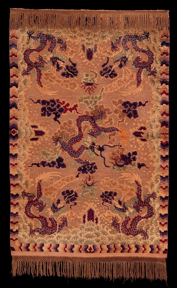 Rug with a bronze colored field achieved by applying braided metallic threads to the base web of cotton. The design of five…