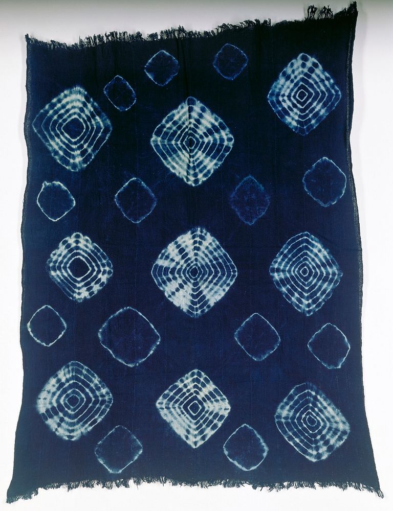 tie-dyed dark blue ground; 12 horizontal bands sewn together; decorated with light blue concentric diamonds and shadowy…