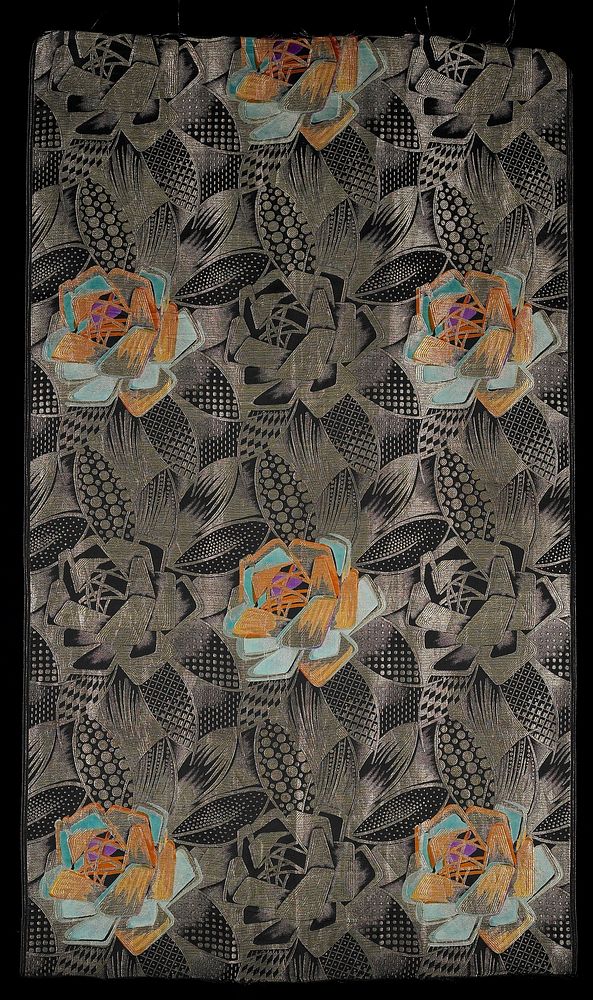 jacquard woven; gold on black with sections in orange, turquoise and purple; repeating abstract flower and leaf pattern.…