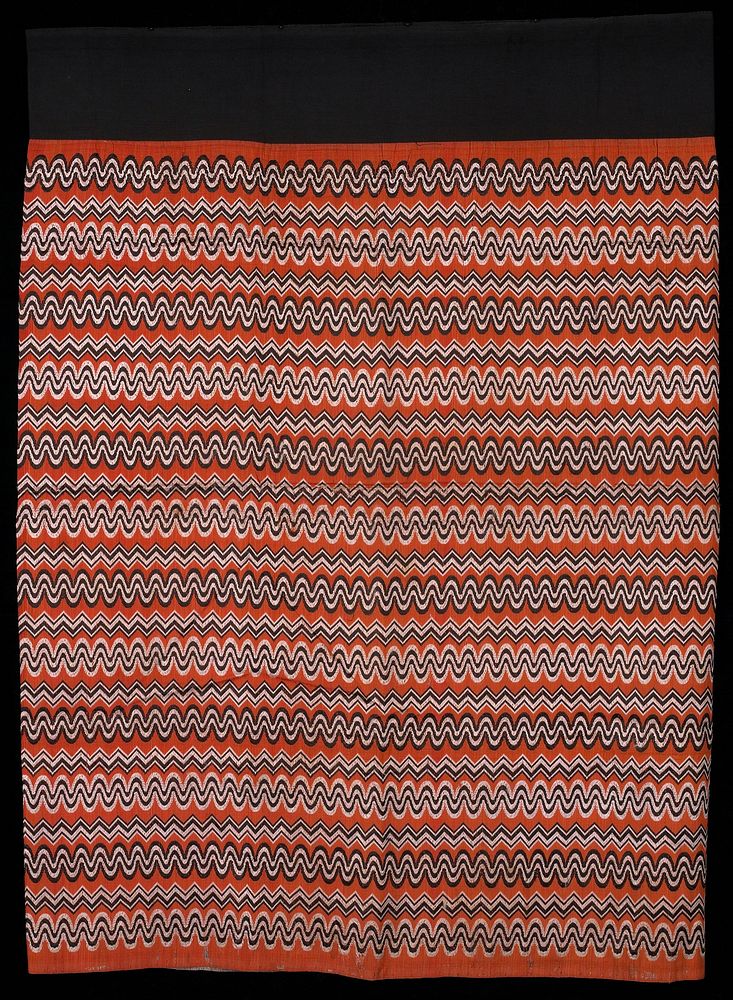 luntaya style, black waist band; black and white woven patterns on dull orange. Original from the Minneapolis Institute of…