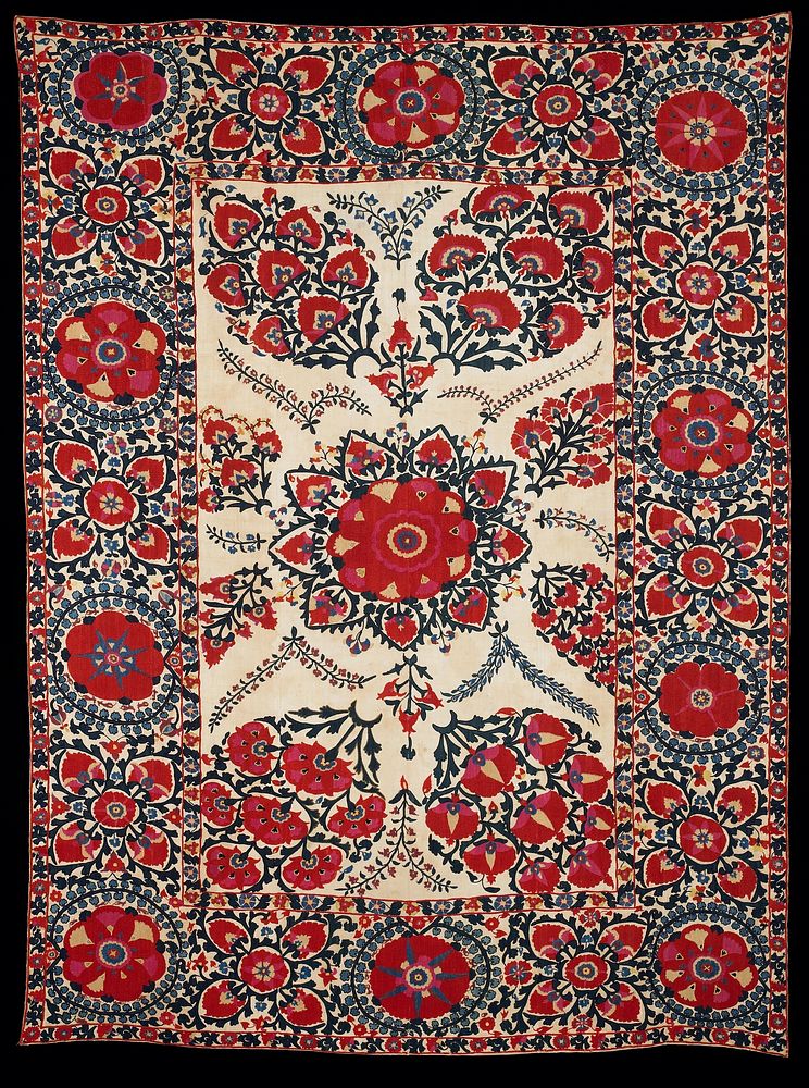 Newly lined.Red and dark blue silk on tan cotton ground. Large center motifs surrounded by wide embroidered border, the a…