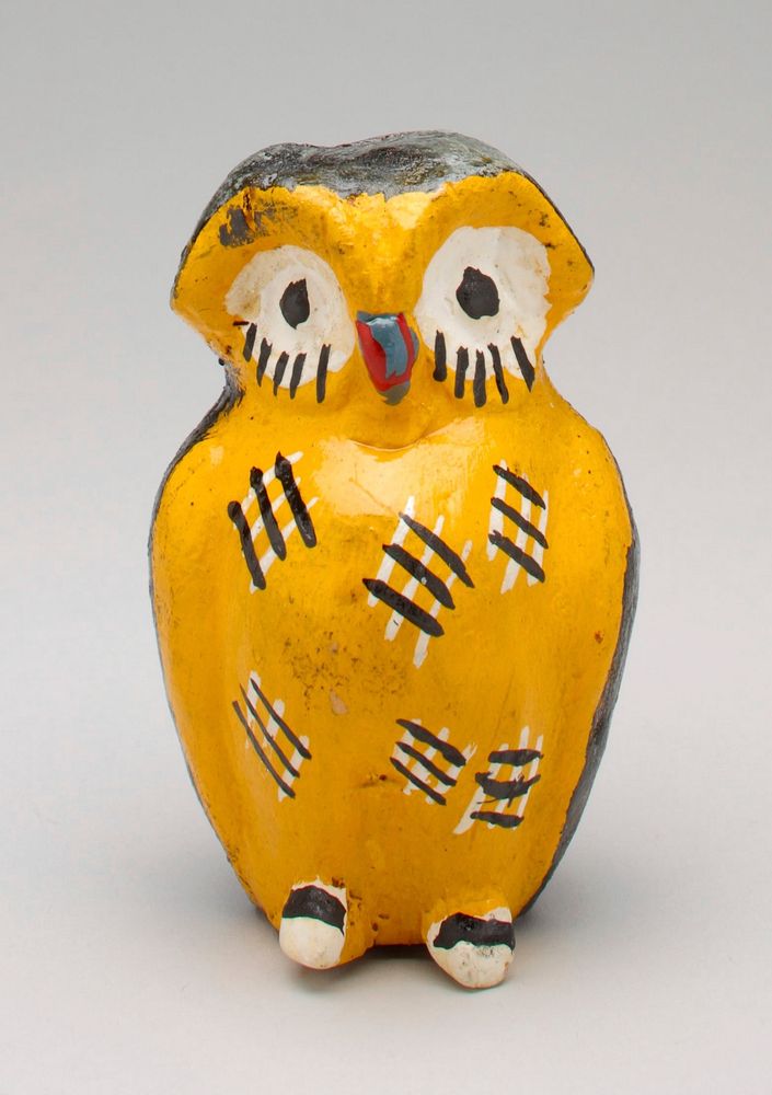 black and yellow ceramic owl; red beak, large white eyes; coin slot in top of head. Original from the Minneapolis Institute…