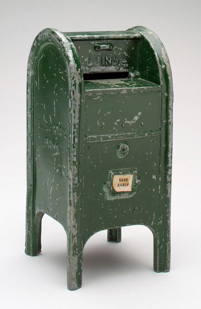 green standing mailbox; "U.S. Mail" on front and sides; "Save Early" on front where pick up times would be. Original from…