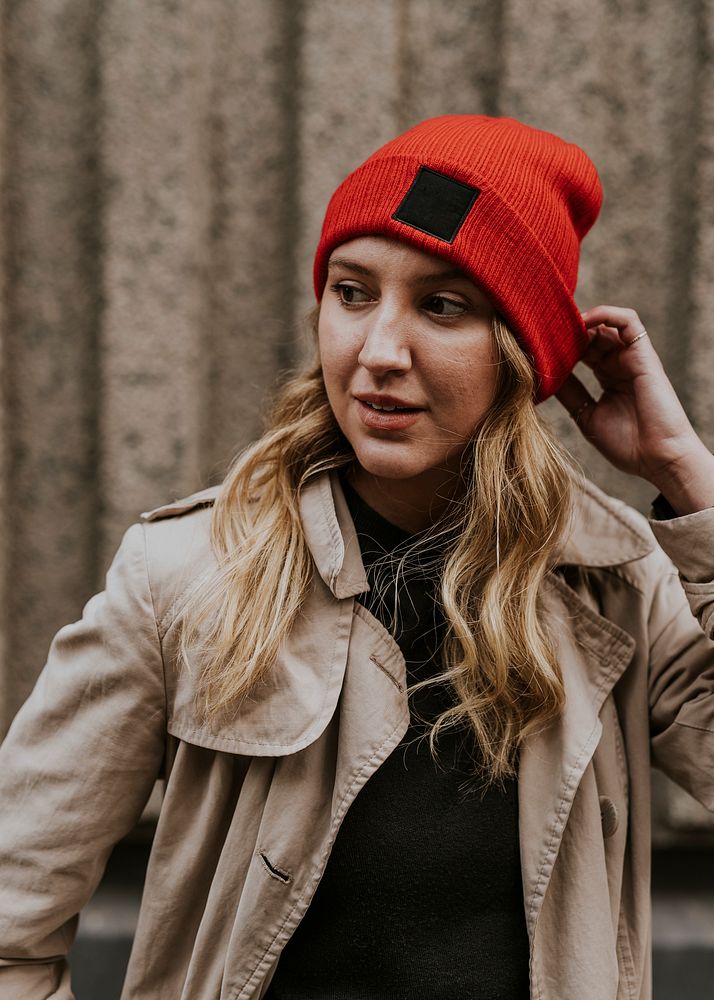 Blonde woman in beanie, beige coat, autumn fashion