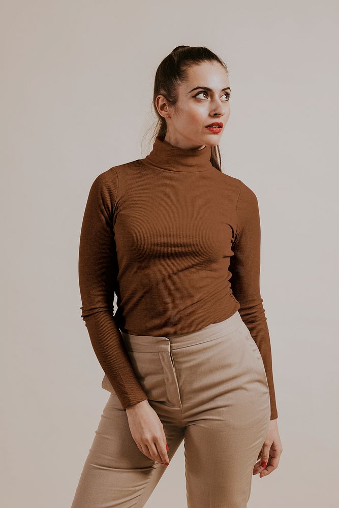 Woman wearing brown turtleneck shirt, studio shoot