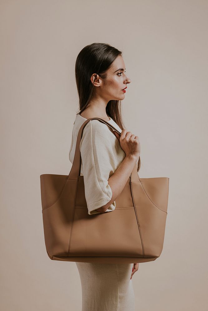 Businesswoman carrying professional beige handbag