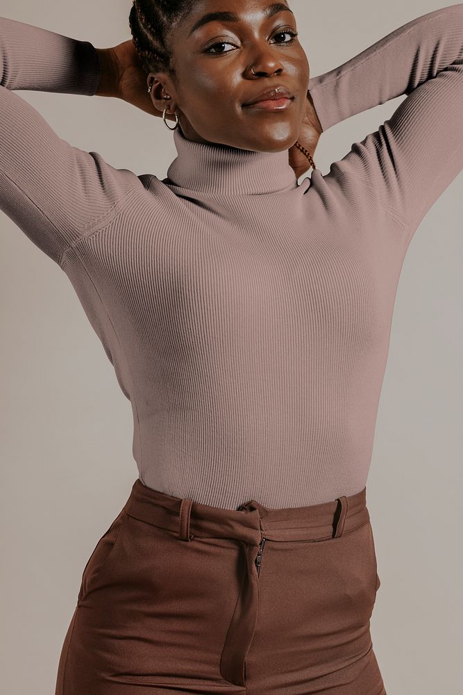 African woman wearing brown turtleneck shirt, studio shoot