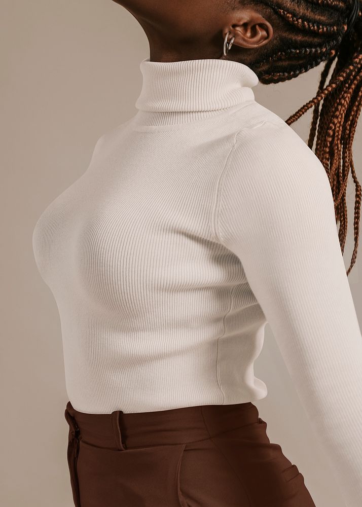 African woman wearing white turtleneck shirt, studio shoot