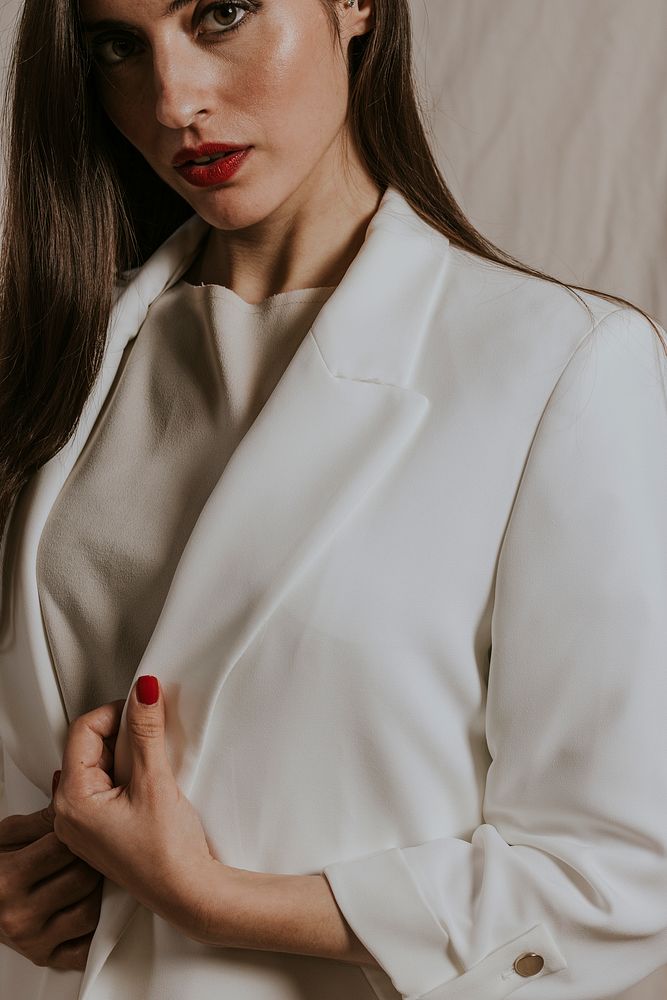 Businesswoman in white suit, formal fashion