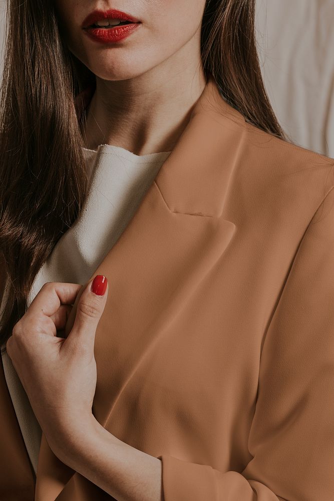 Confident woman wearing blazer, business attire studio shoot