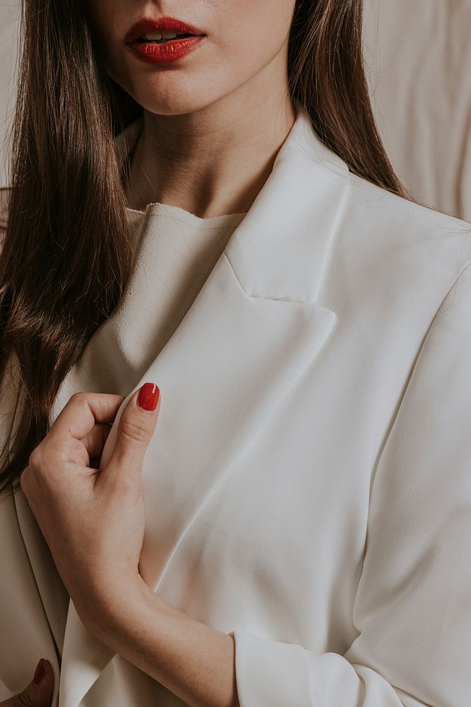 Businesswoman in white suit, formal fashion