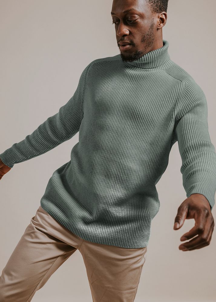 Man wearing blue turtleneck shirt, studio shoot