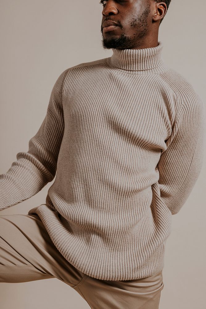 Man wearing beige sweater, khaki pants, minimal fashion