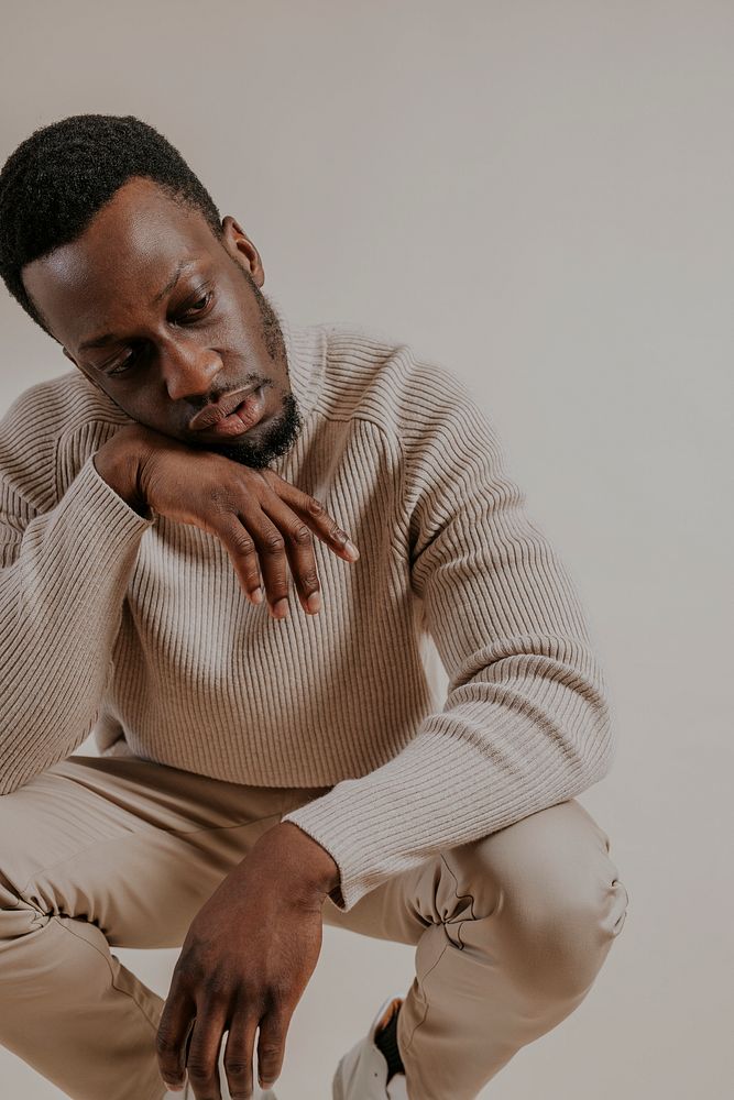 Man wearing beige sweater, khaki pants, minimal fashion