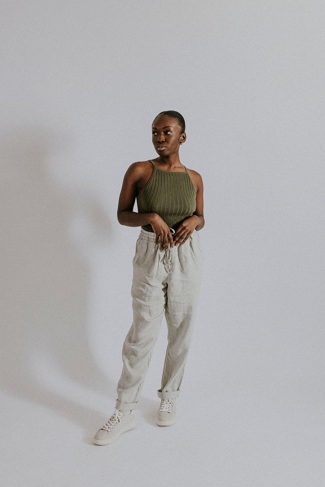 Woman wearing green tank top, sweatpants, loungewear fashion