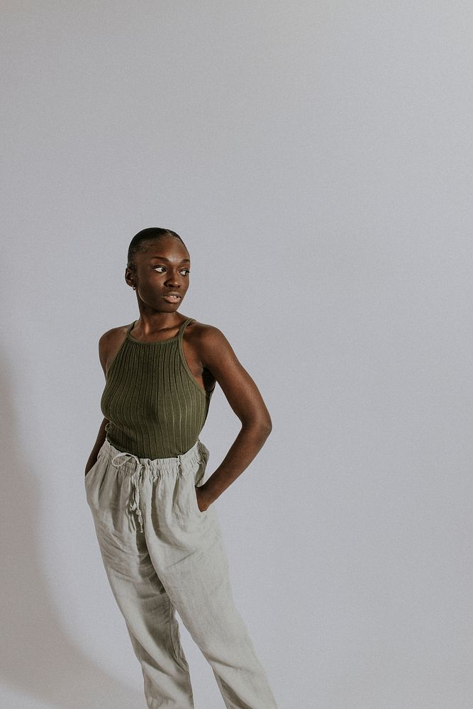 Woman wearing green tank top, sweatpants, loungewear fashion