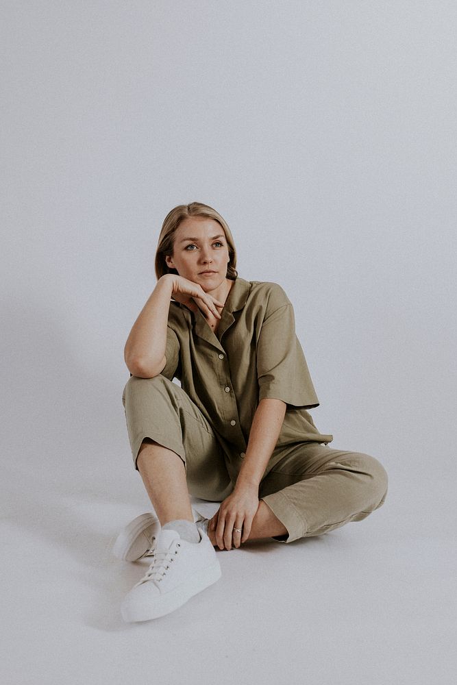 Woman wearing green shirt, pants, minimal loungewear