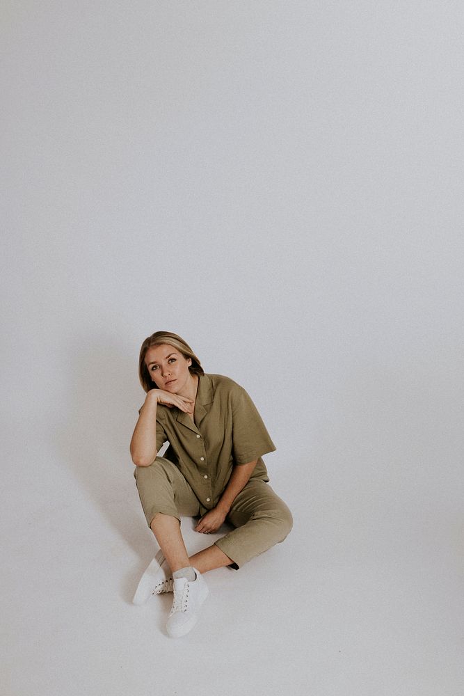 Woman wearing green shirt, pants, minimal loungewear