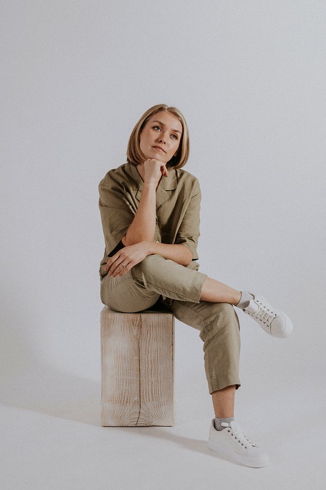 Woman wearing green shirt, pants, minimal loungewear