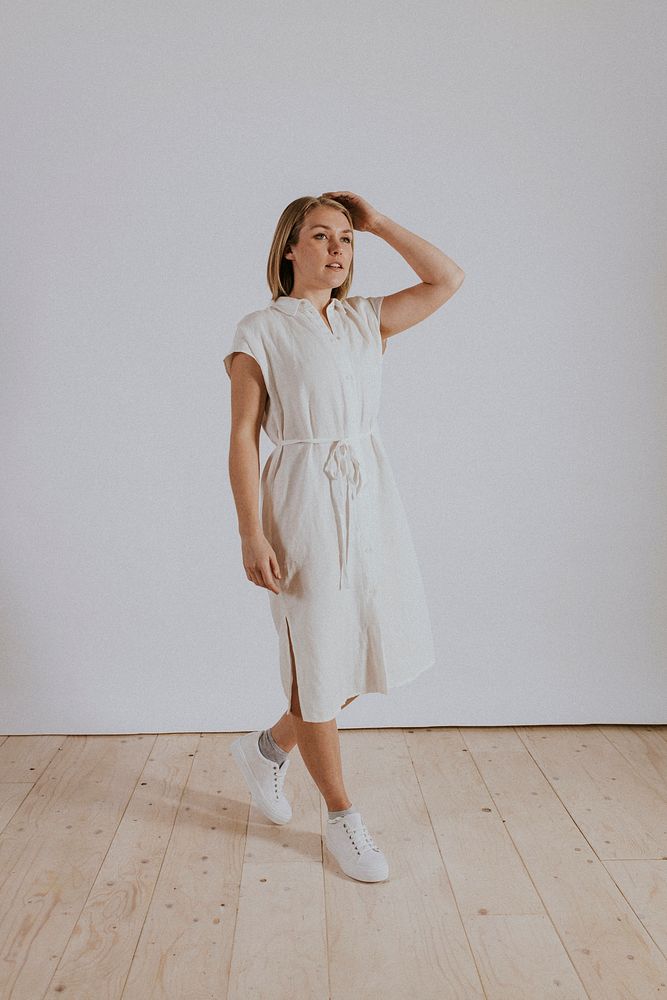 Woman wearing white linen dress, minimal fashion