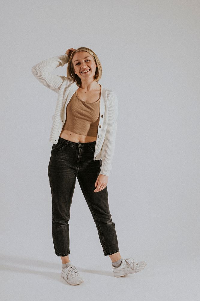 Women's casual outfit, crop top, jeans and cardigan