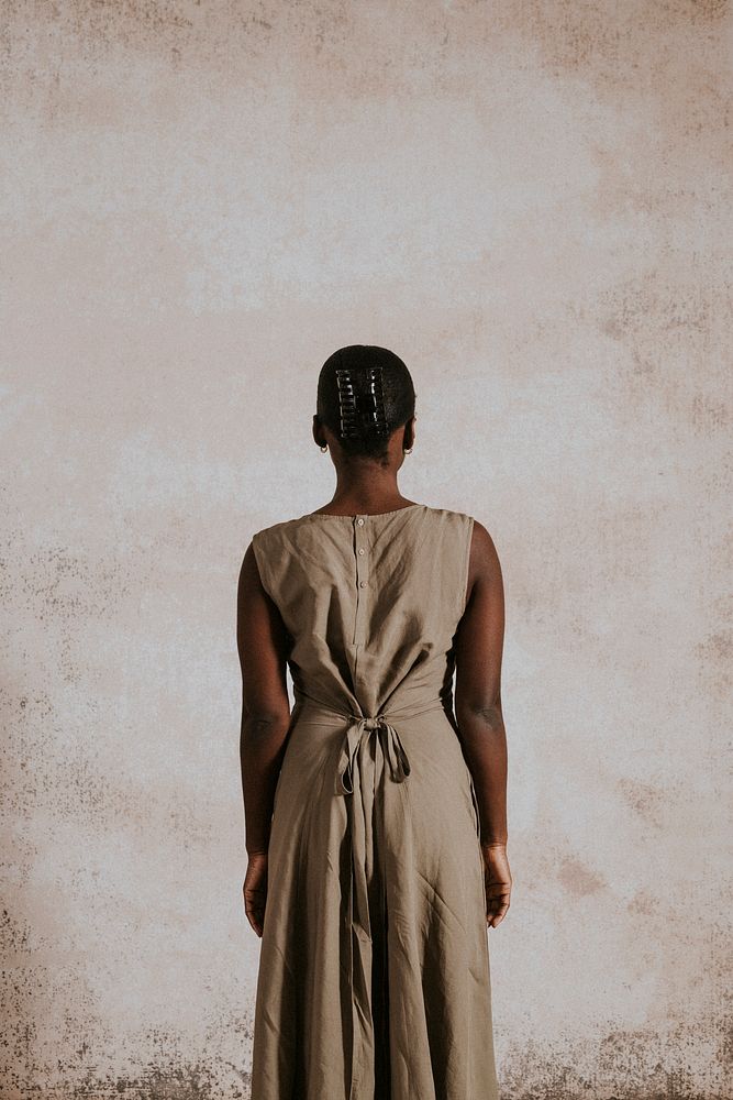 Woman in brown linen dress, minimal fashion