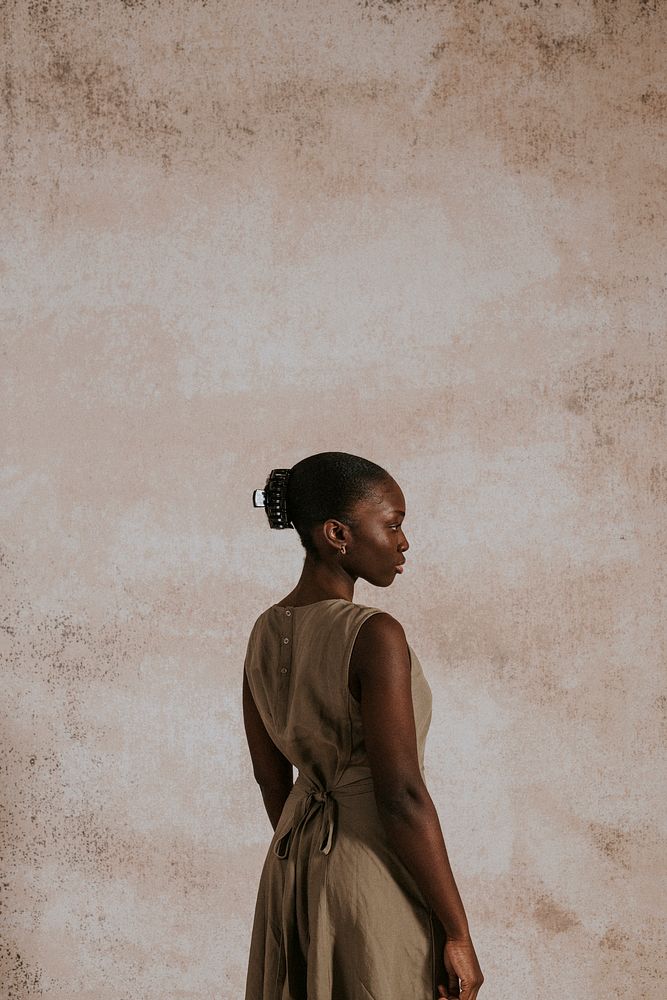 Woman in brown linen dress, minimal fashion