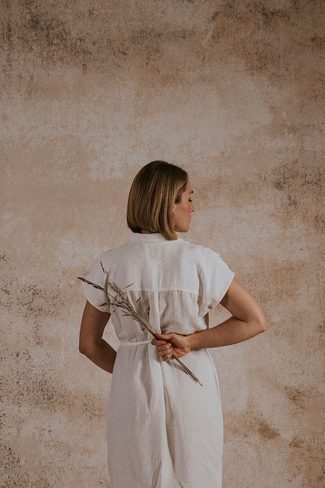 Woman in white linen dress, minimal fashion