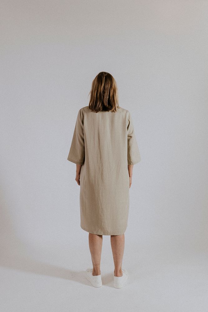 Mature woman wearing linen dress, minimal fashion