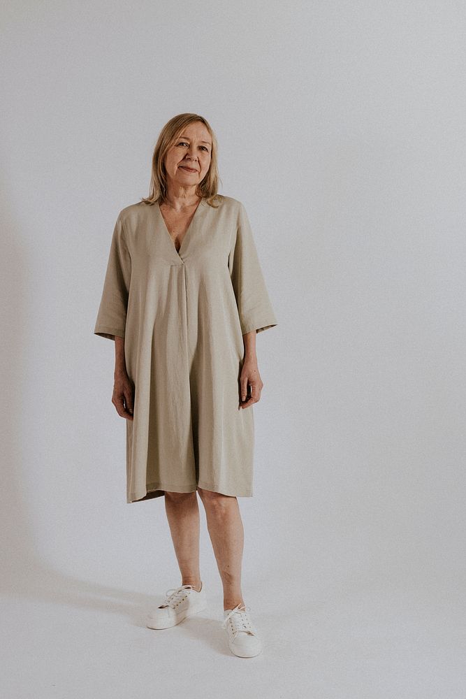 Mature woman wearing linen dress, minimal fashion