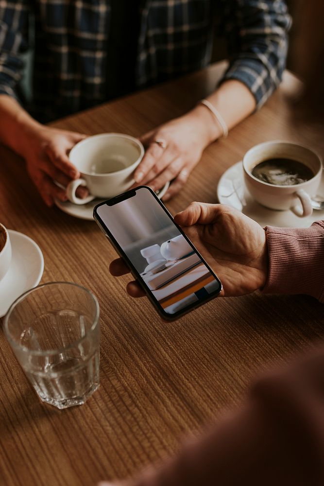 Man hand using phone coffee Premium Photo rawpixel