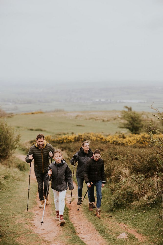 Family hiking on hill, outdoor activity