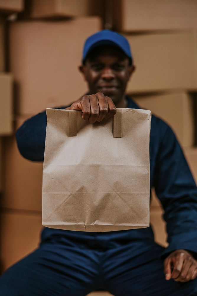 Food delivery man holding bag