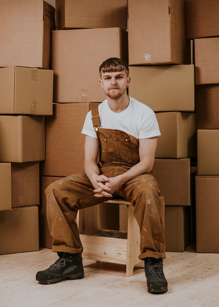 Moving service provider, man in overalls, job & career photo